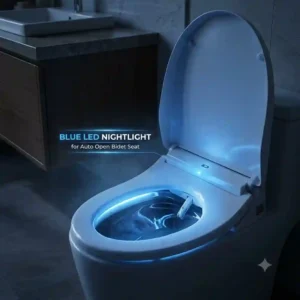 "The soft blue LED nightlight illuminating the bowl of an auto open bidet seat in a dark bathroom."